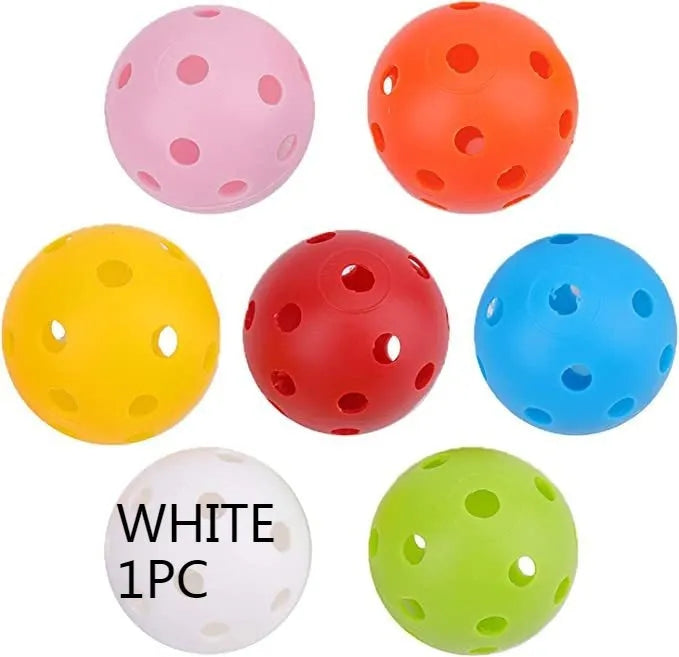 Multi-coloured golf practice balls in net storage pocket for putting training