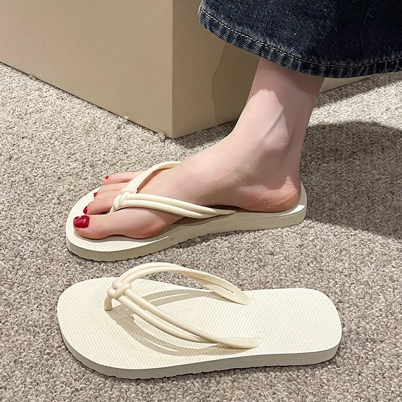 Men's casual PVC flip flops in beige with toe-covering style and injection moulded sole.