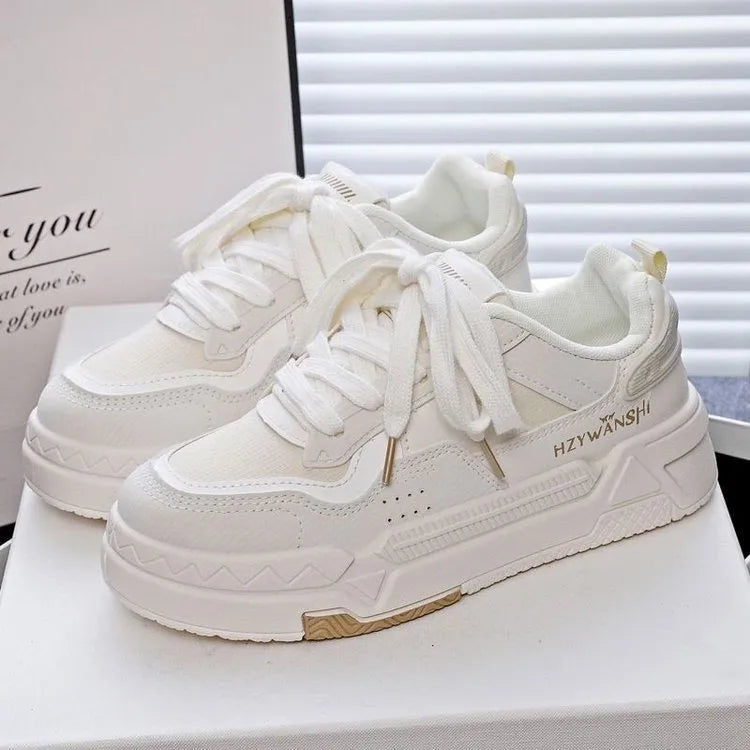 Children's beige board shoes with thick rubber soles, front lace-up closure, and cross shoulder straps.