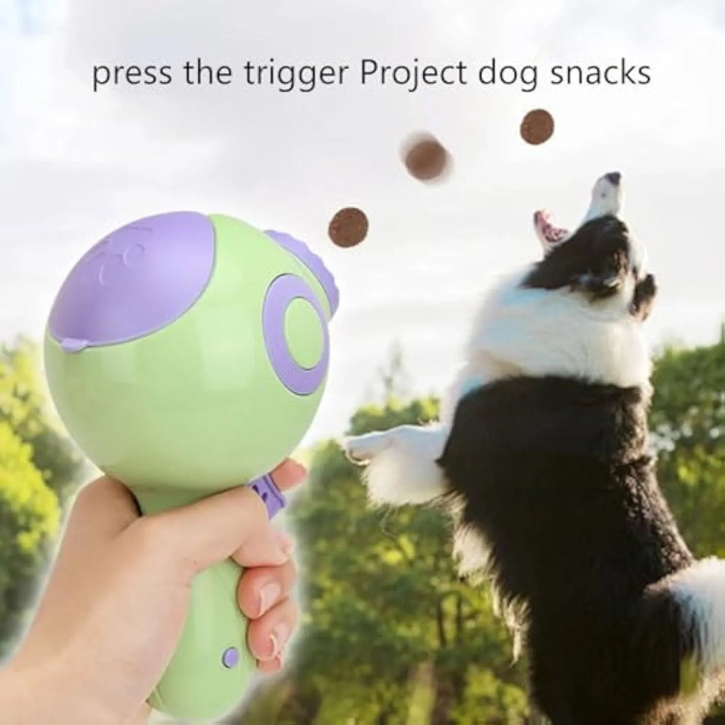 Green, orange, and pink dog treat launcher toy measuring 15.5 cm by 9 cm by 8.5 cm for remote feeding and training