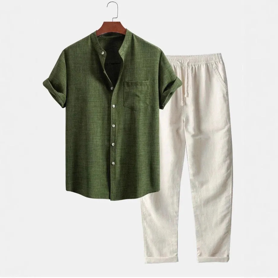 Men's blue slim-fit short-sleeved shirt with stand collar, part of a set with trousers, shoes, and watch