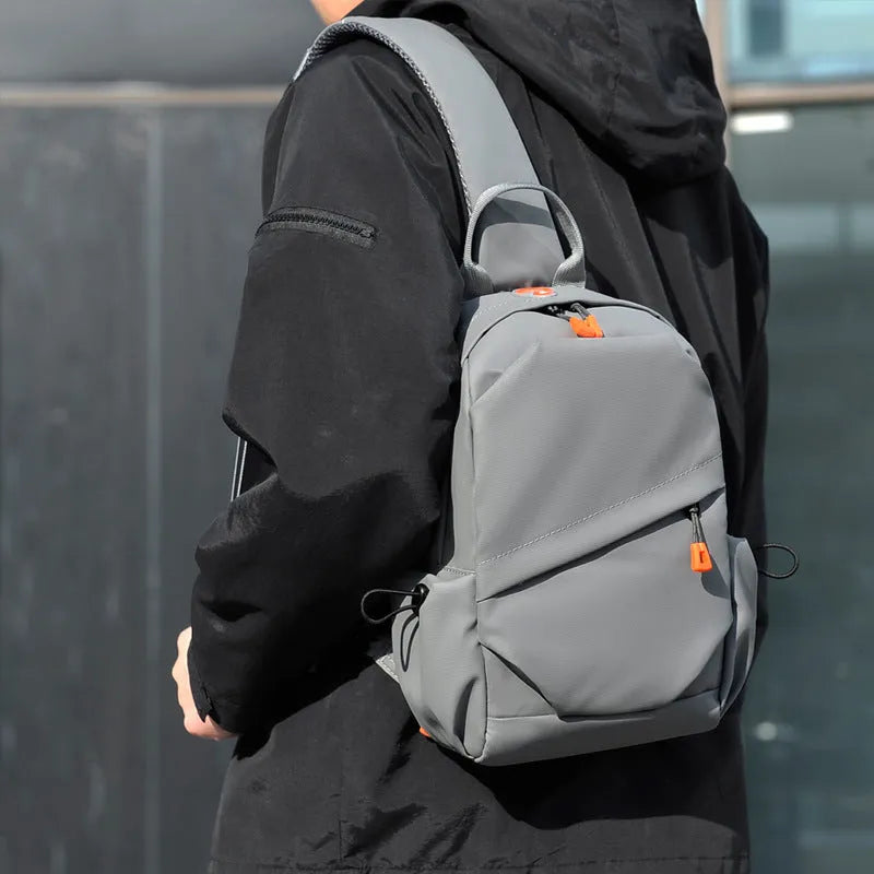 Black and grey mens casual single shoulder crossbody bag made of waterproof polyester.
