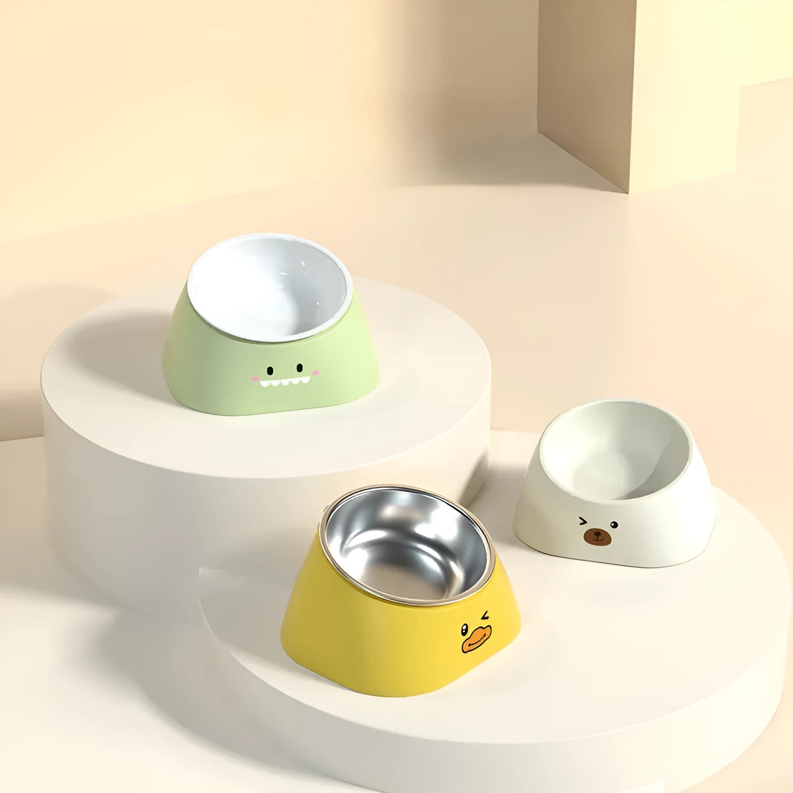 Green tilted stainless steel cat bowl on a white surface.