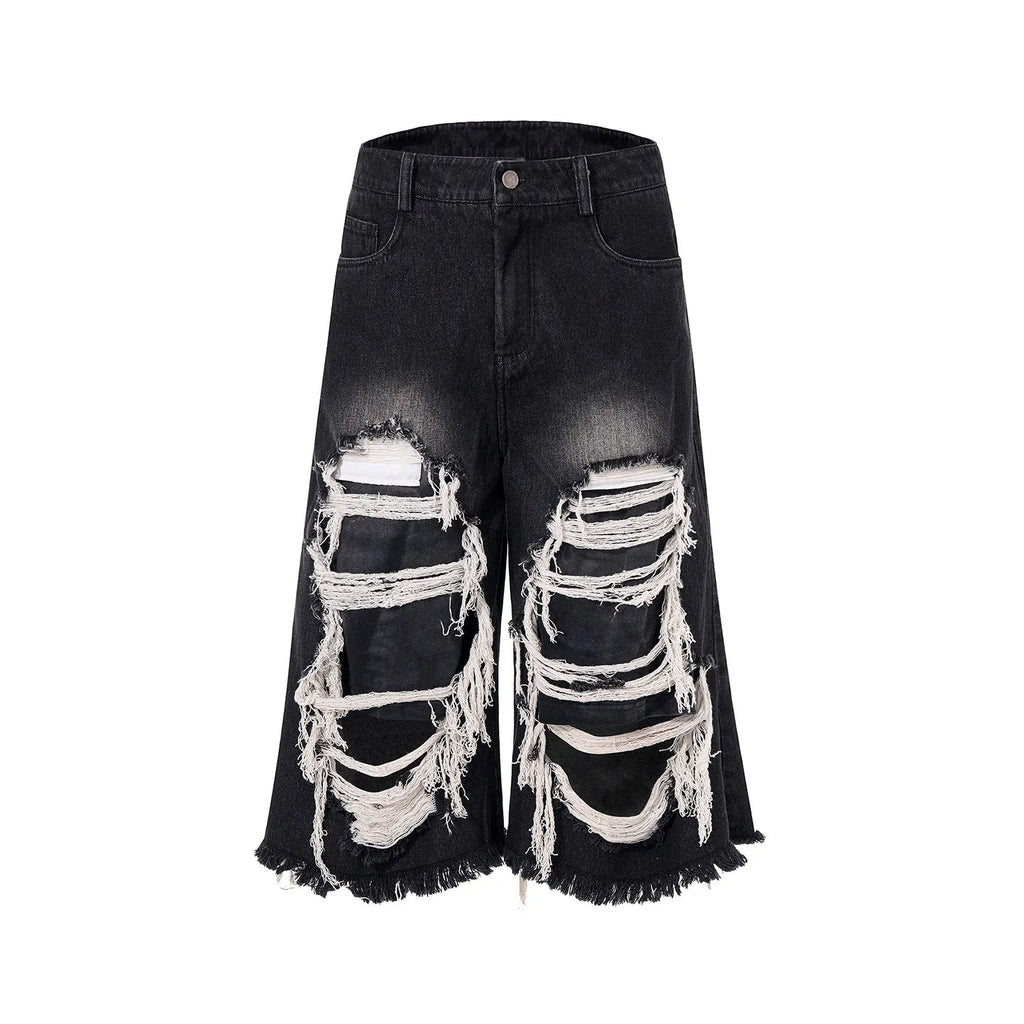 Black cropped wide-leg women's jeans with ripped patches on the knees.