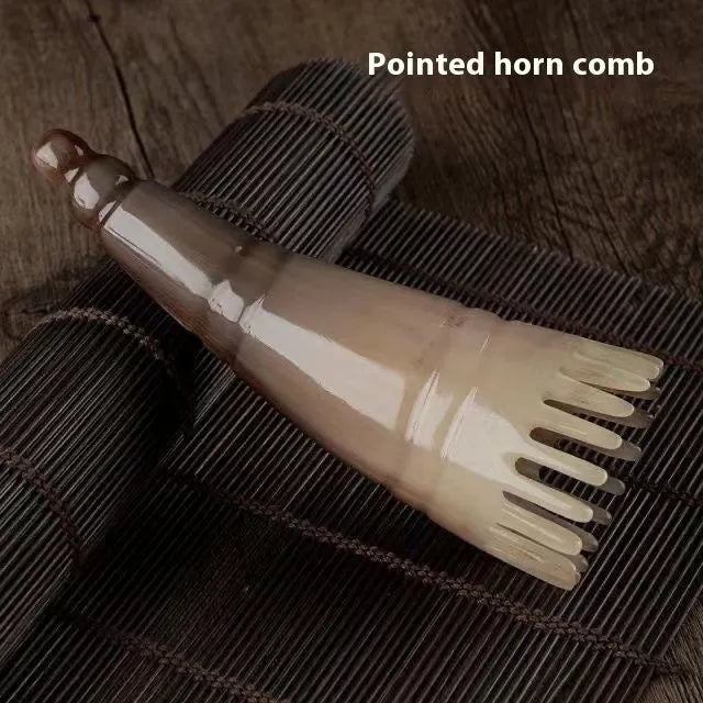 Traditional white buffalo horn meridian massage comb for scalp stimulation and hair care.