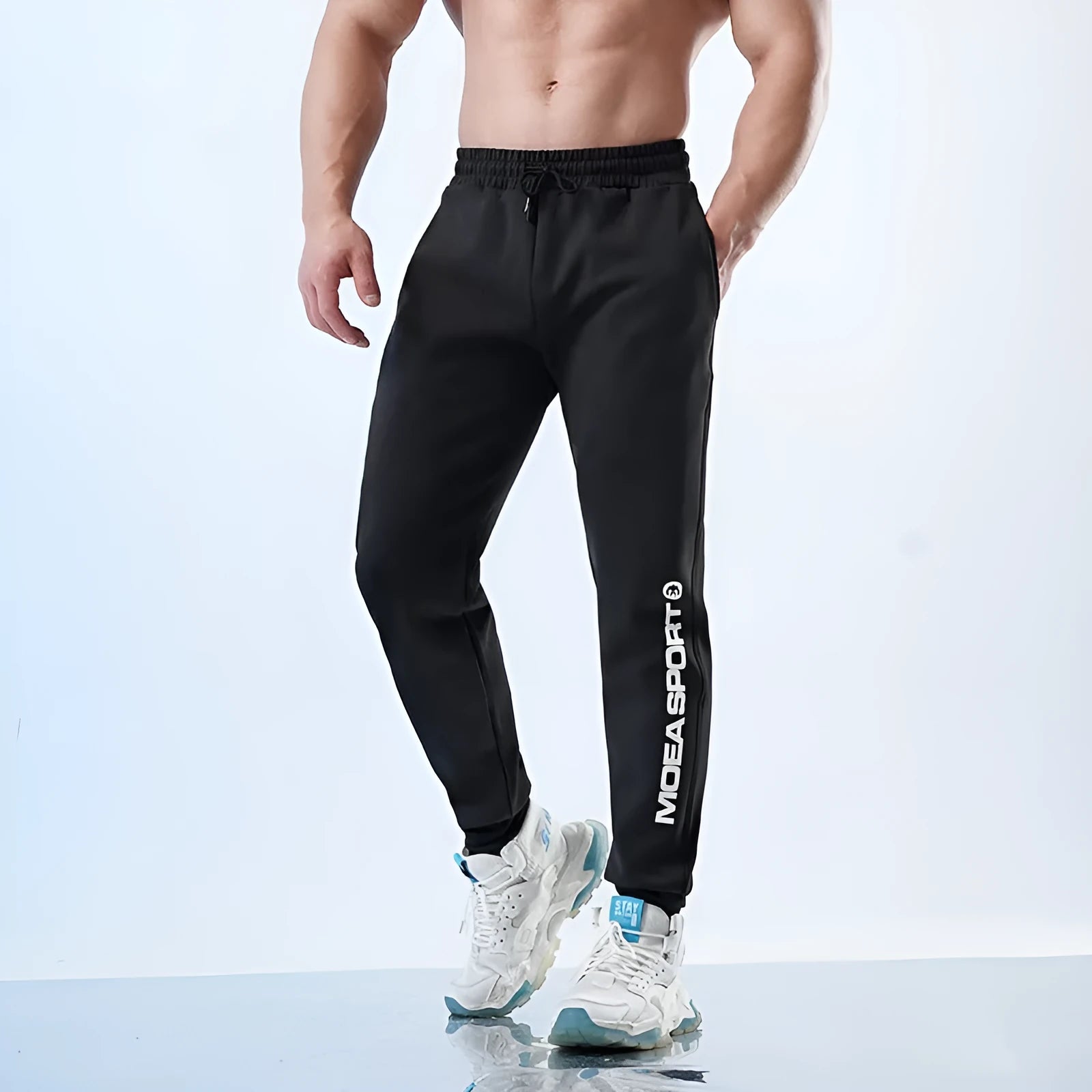 Men's grey sweatpants with ankle ties and tapered leg in polyester-spandex blend