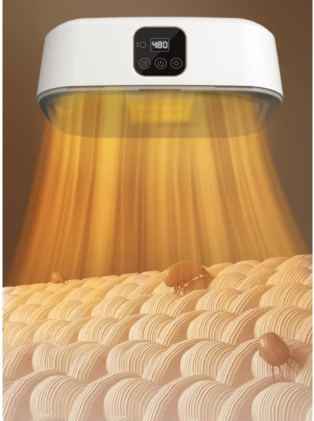 White cylindrical foldable laundry dryer with remote control on a table.