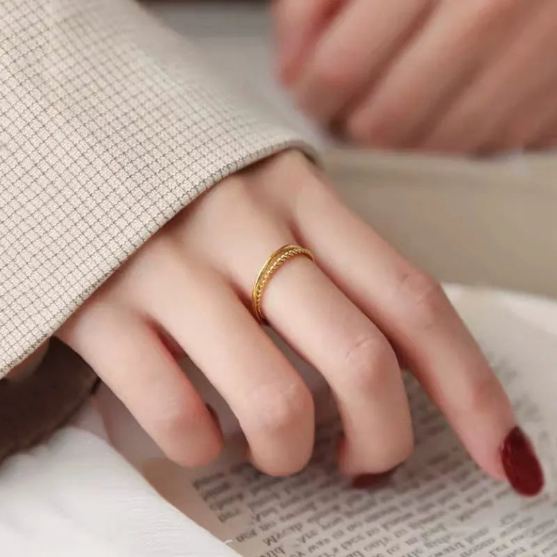 Gold plated brass women's ring in bracelet, twist, matte, and glossy styles showing UK size options.