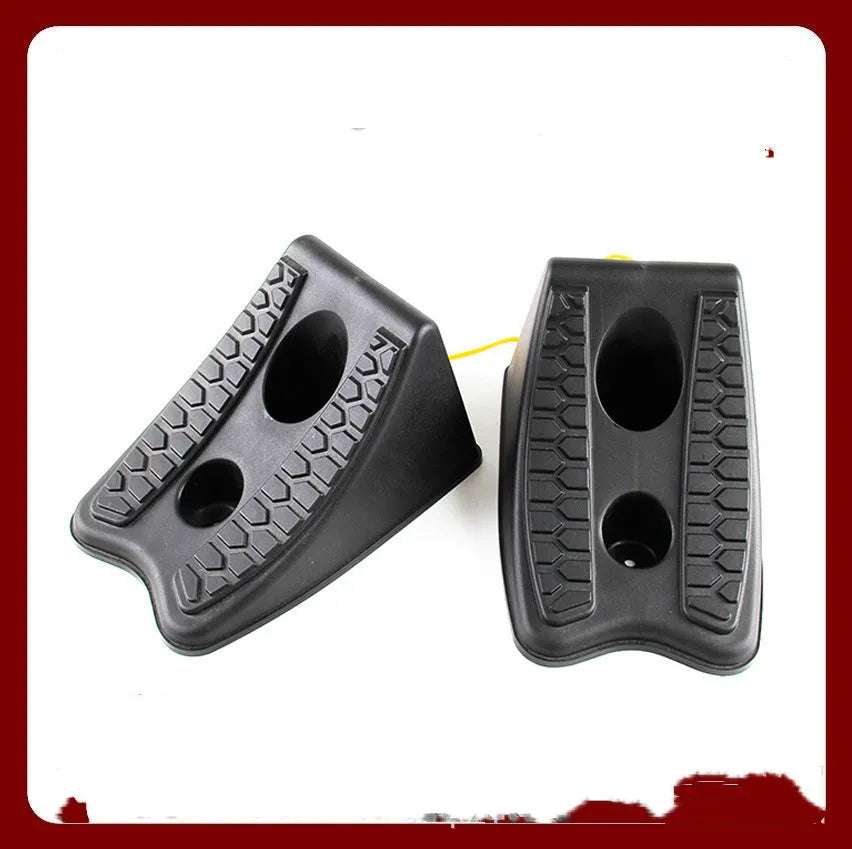 Pair of black wedge-shaped rubber car wheel stoppers with arc bevel and anti-slip base