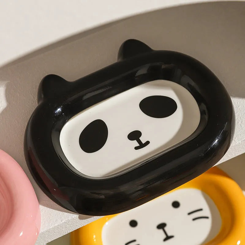 Ceramic pet bowl with a raised animal motif design on the side, shown in one of six available themes.