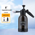 Black hand-held 2 litre foam sprayer with lock switch and nozzle attachments