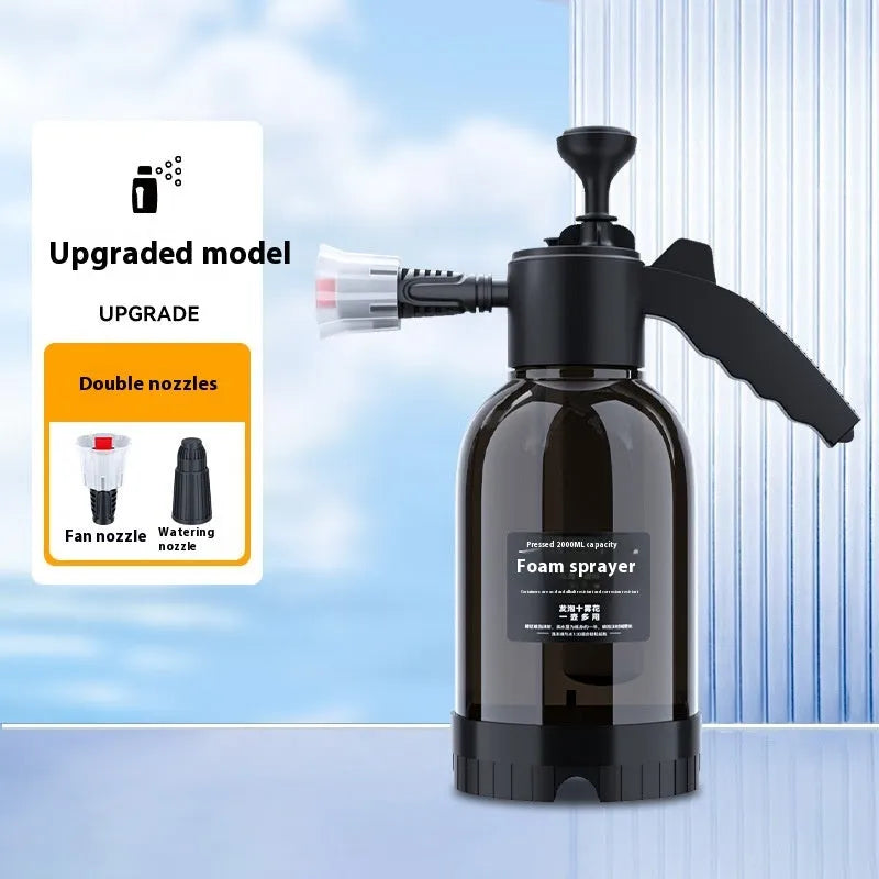Black hand-held 2 litre foam sprayer with lock switch and nozzle attachments