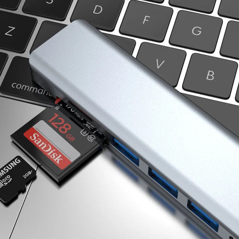 Seven-in-one Type-C USB expander hub with a short 0.145m cable on a white background.