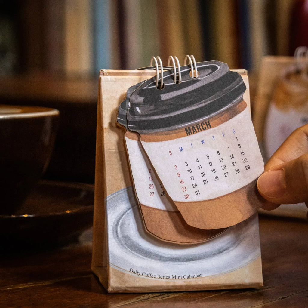 Mini 2025 desk calendar showing coffee theme with motivational design