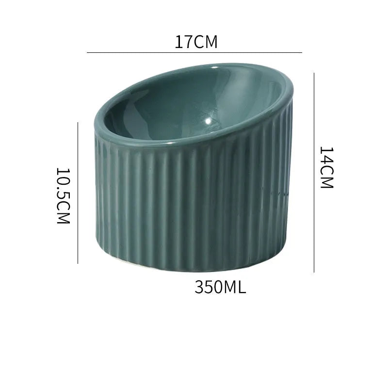 Round ceramic elevated cat bowl in green colour on a table