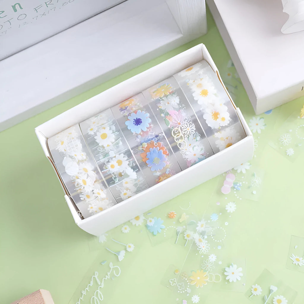 Five rolls of transparent decorative adhesive tape with Midsummer Daisy pattern, showing 1.5cm width