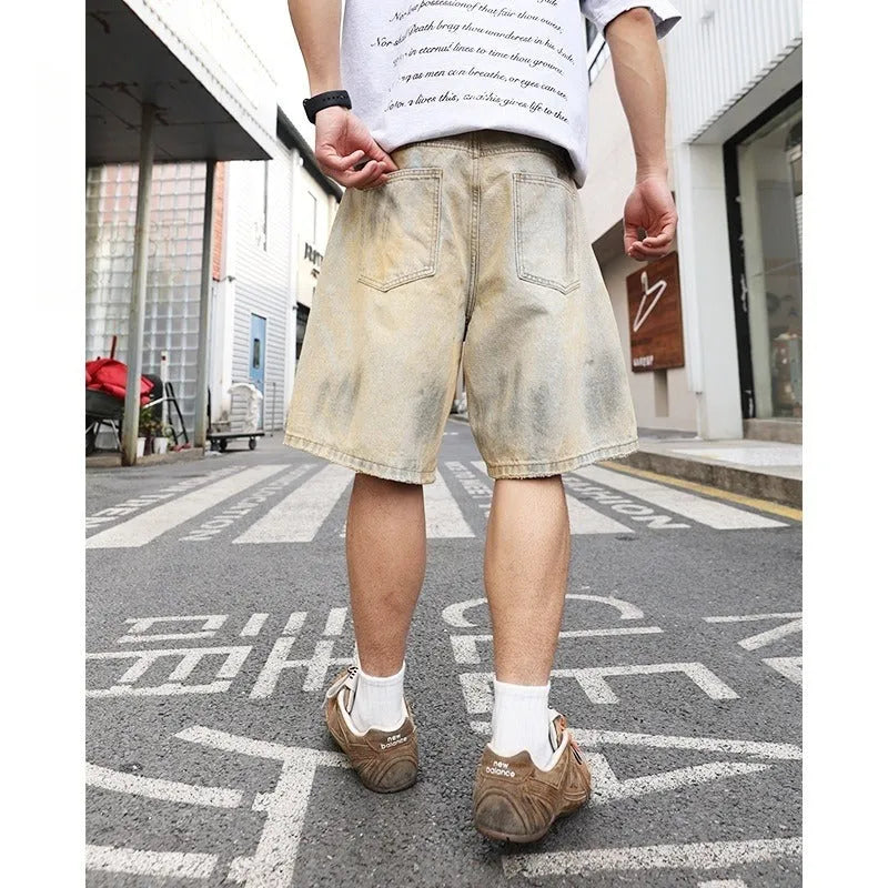 Men's light blue ripped denim shorts with washed old vintage styling