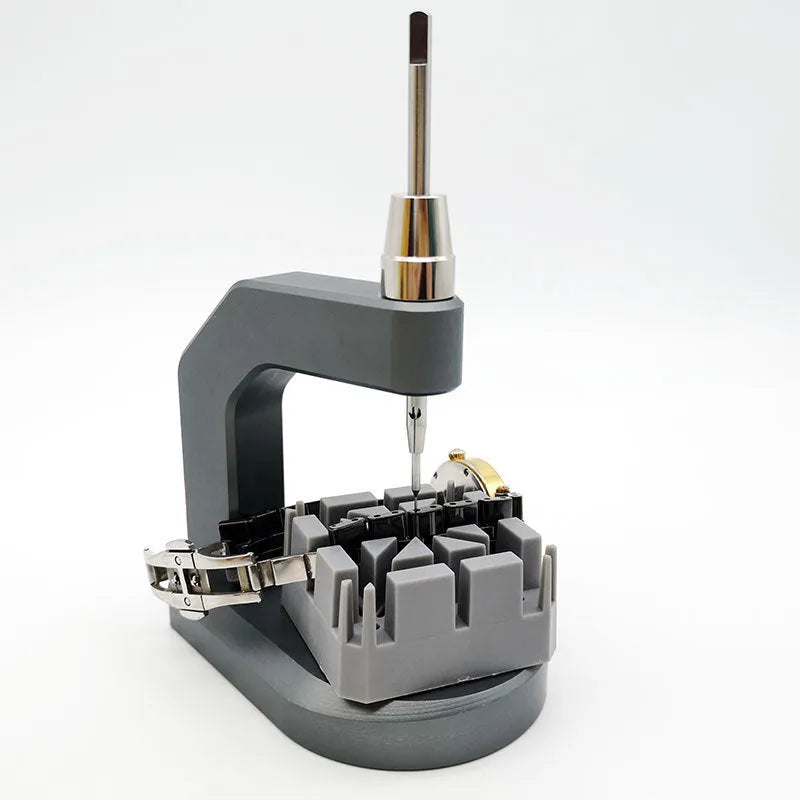 Silver-coloured press strap removal tool for watch and electronics repair.