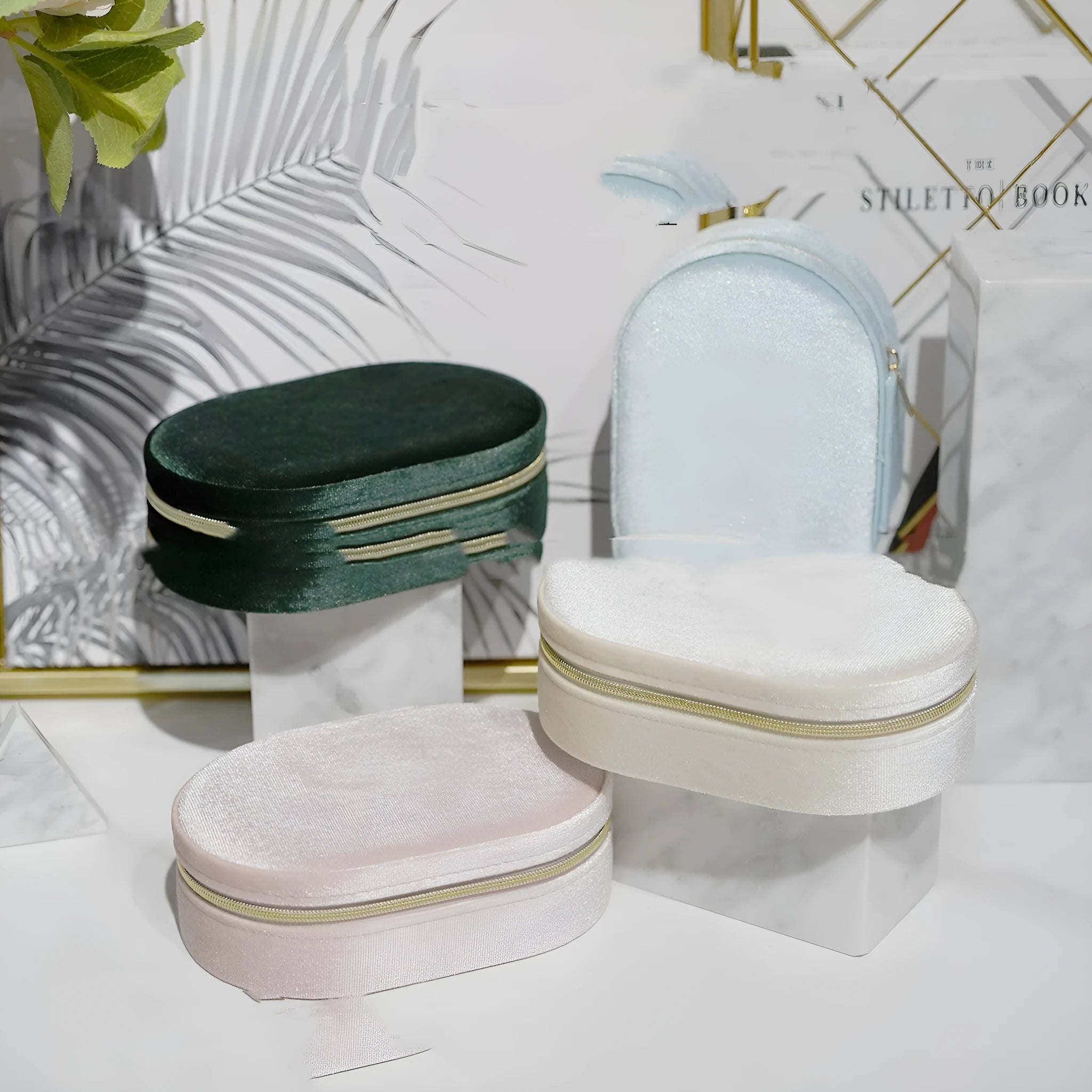 Oval velvet jewellery storage box in lake blue colour, showing soft flannel interior lining.