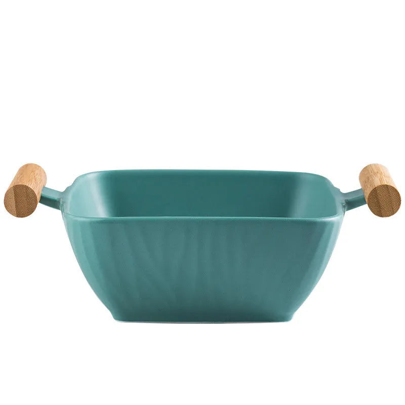 Porcelain ceramic bowl with irregular shape and matching lid in modern simple design