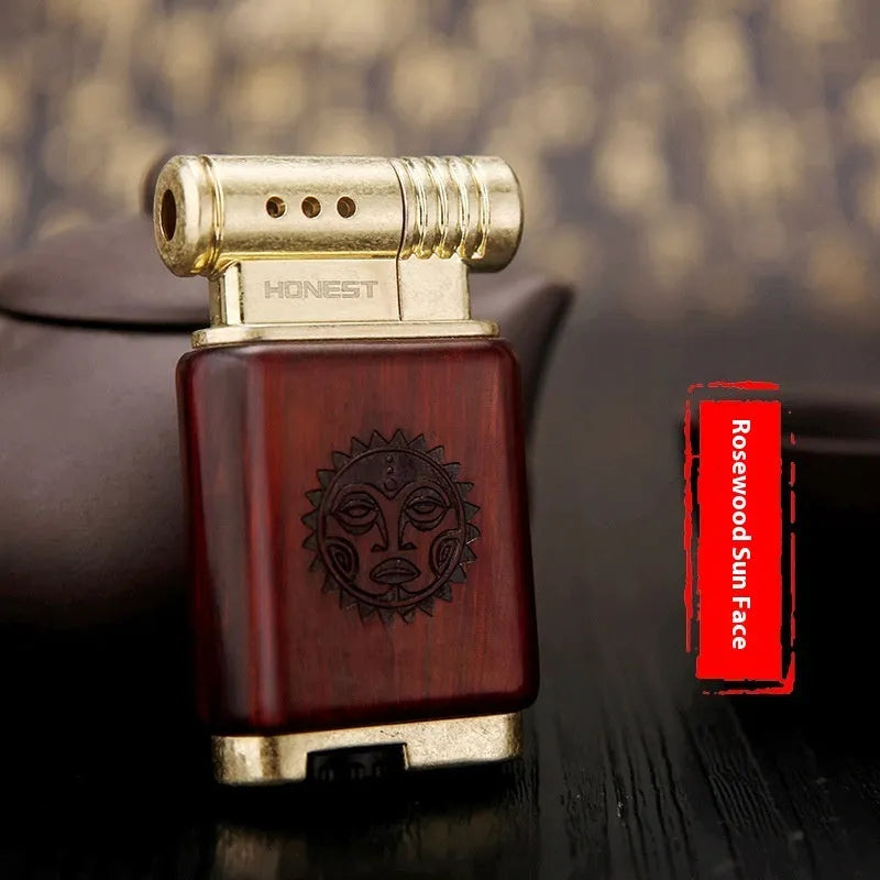Black wood gas lighter with rosewood decorative finishes including sun face design
