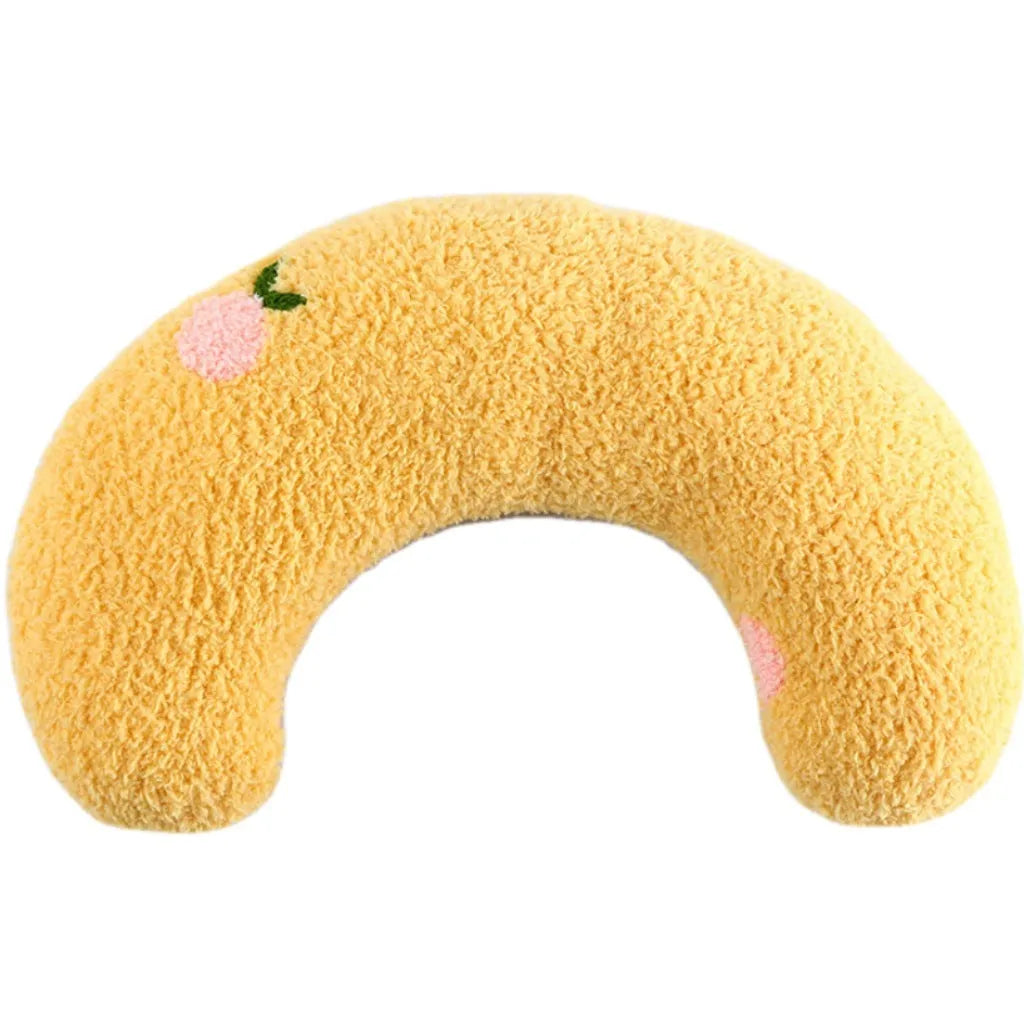 White U-shaped plush pet pillow for a cat, showing its donut shape and quilted texture.