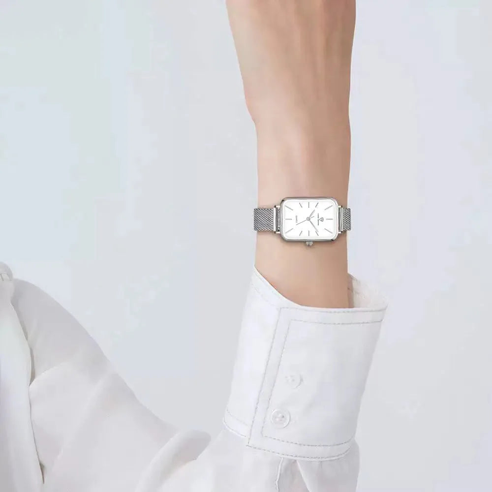 Women's rose gold waterproof watch with a woven steel strap and quartz movement.
