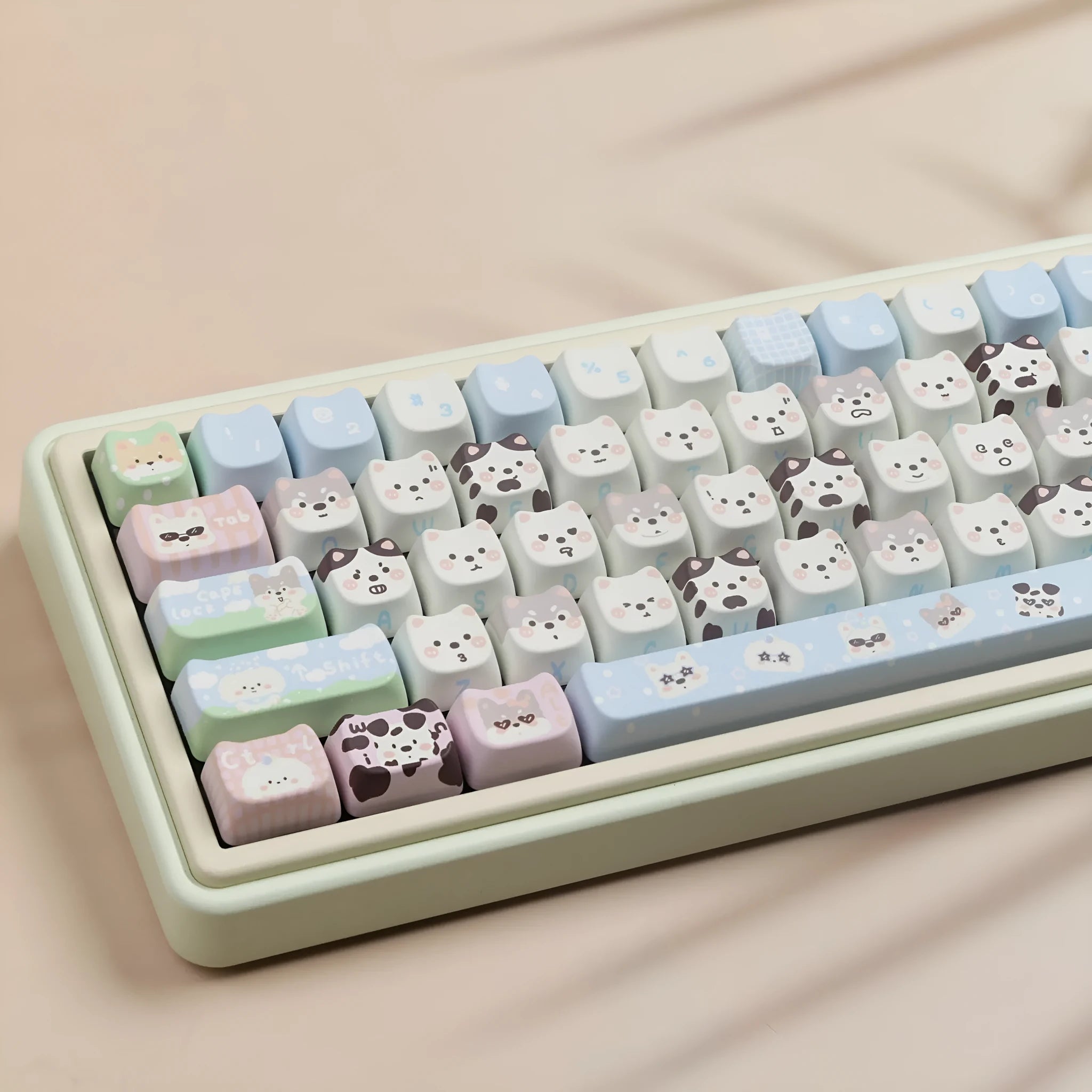 PBT sublimation keycap set showing cat and puppy character designs on mechanical keyboard keys