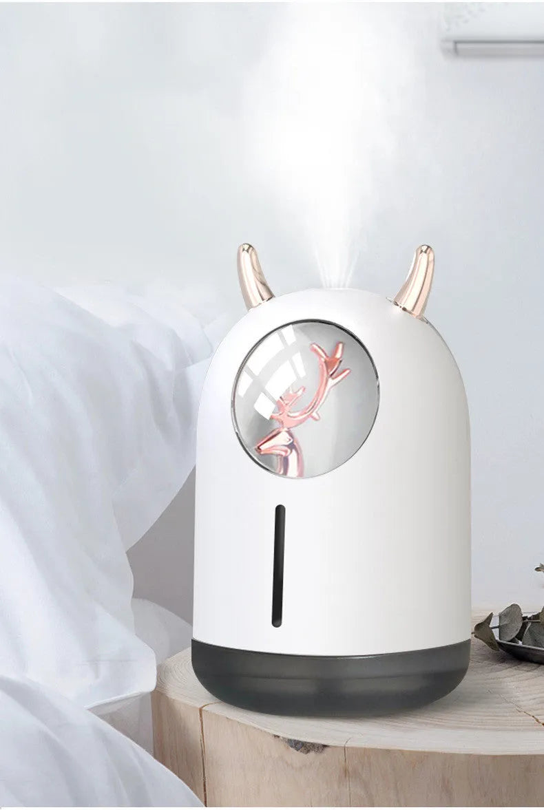 Mini animal-shaped USB aroma diffuser humidifier in white or pink with single mist outlet for small spaces