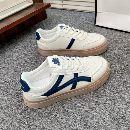 Brown and blue low-top lace-up casual shoes with a patent leather finish and round toe.
