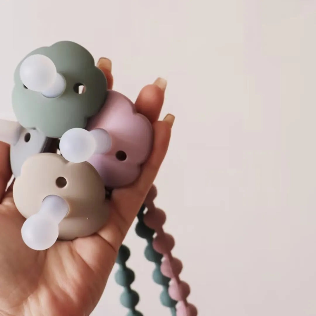 Baby pacifier with silicone lace nipple in 6.5x5x5cm size available in 11 colours for 0-6 months