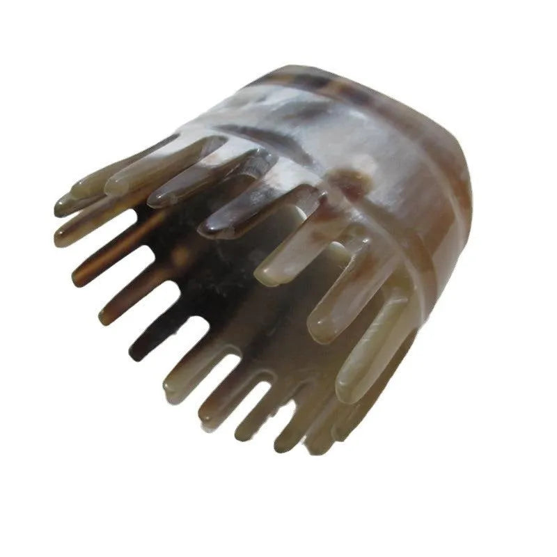 Traditional white buffalo horn meridian massage comb for scalp stimulation and hair care.