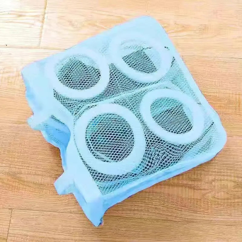 Shoe washing bag in blue mesh with foam padding, hidden zipper, and side lanyards for machine washing