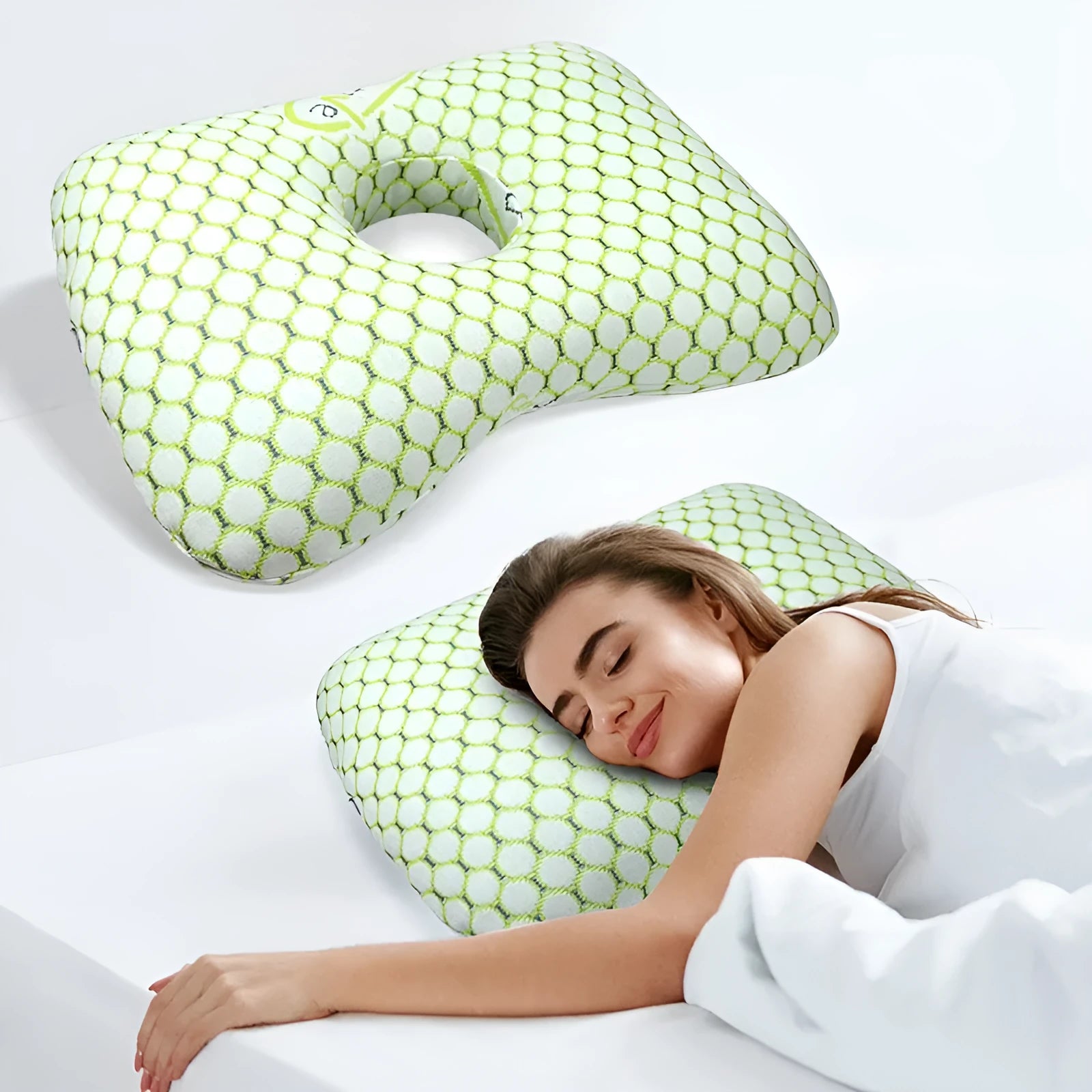 Single hole ear support pillow in grey on a white background, showing its contour and compact size.