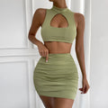 Women's light purple hollow vest and matching split hip skirt two-piece set on a mannequin