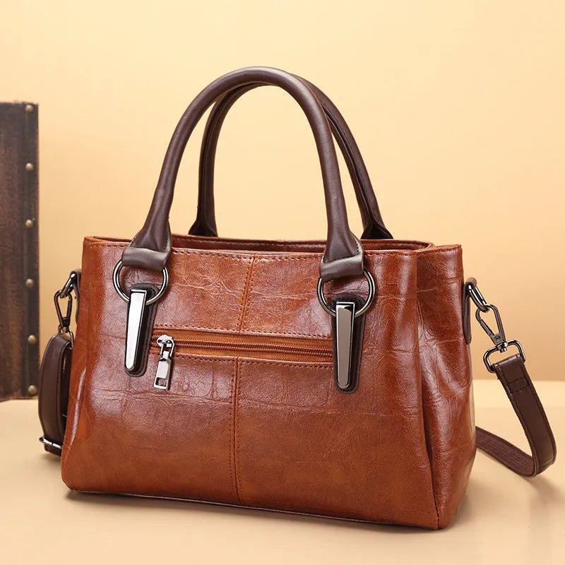 PU leather shoulder bag in vintage brown colour with internal organiser compartments and single strap