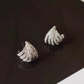 A pair of geometric-shaped earrings with a line design, made from zircon with an electroplated platinum finish.
