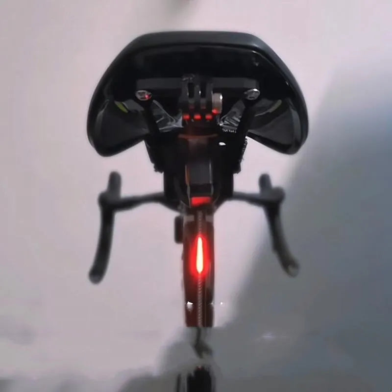 USB rechargeable waterproof bicycle rear light in yellow, red, blue, pink, or white colour options.