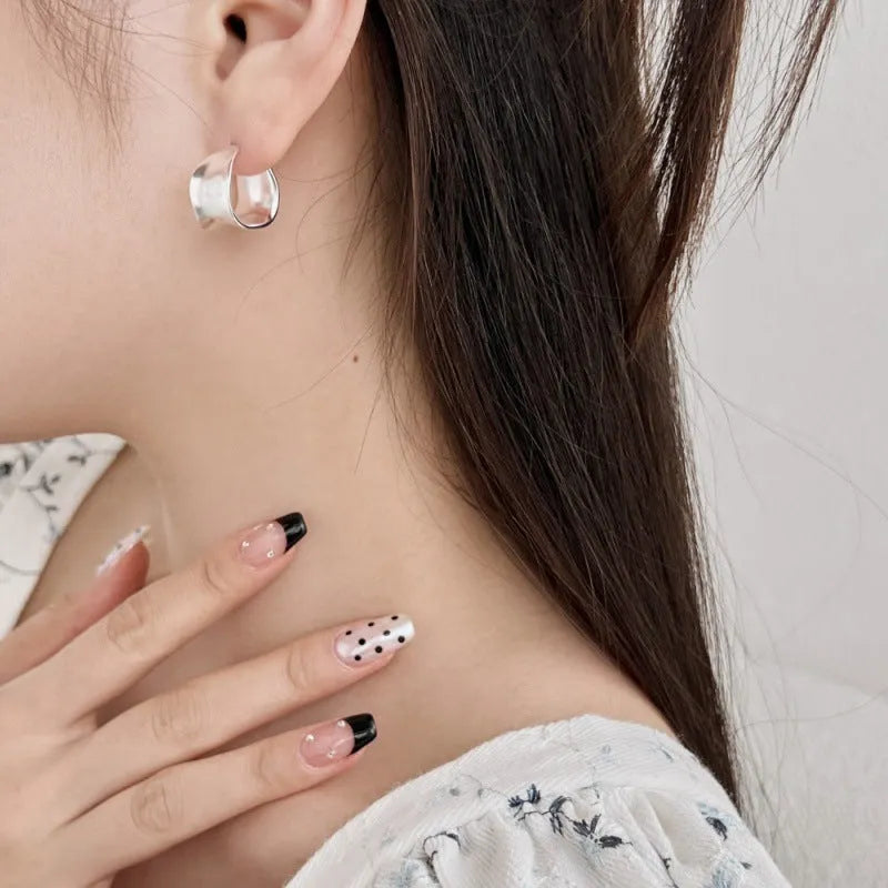 Pair of 925 silver women's ear studs with a wide irregular curved shape, 12 x 17.5mm, silver colour