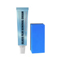 Blue container of car glass oil film remover paste and a soft sponge applicator on a car windshield.
