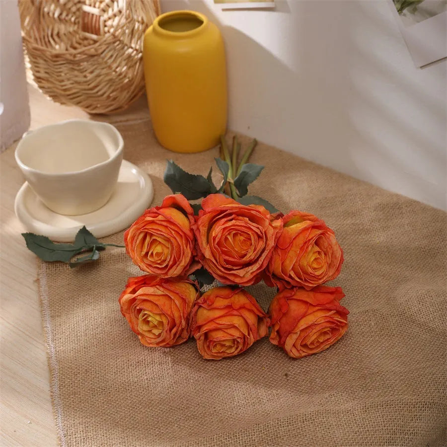 Single burnt edge simulated silk rose artificial flower with 38cm stem on neutral background