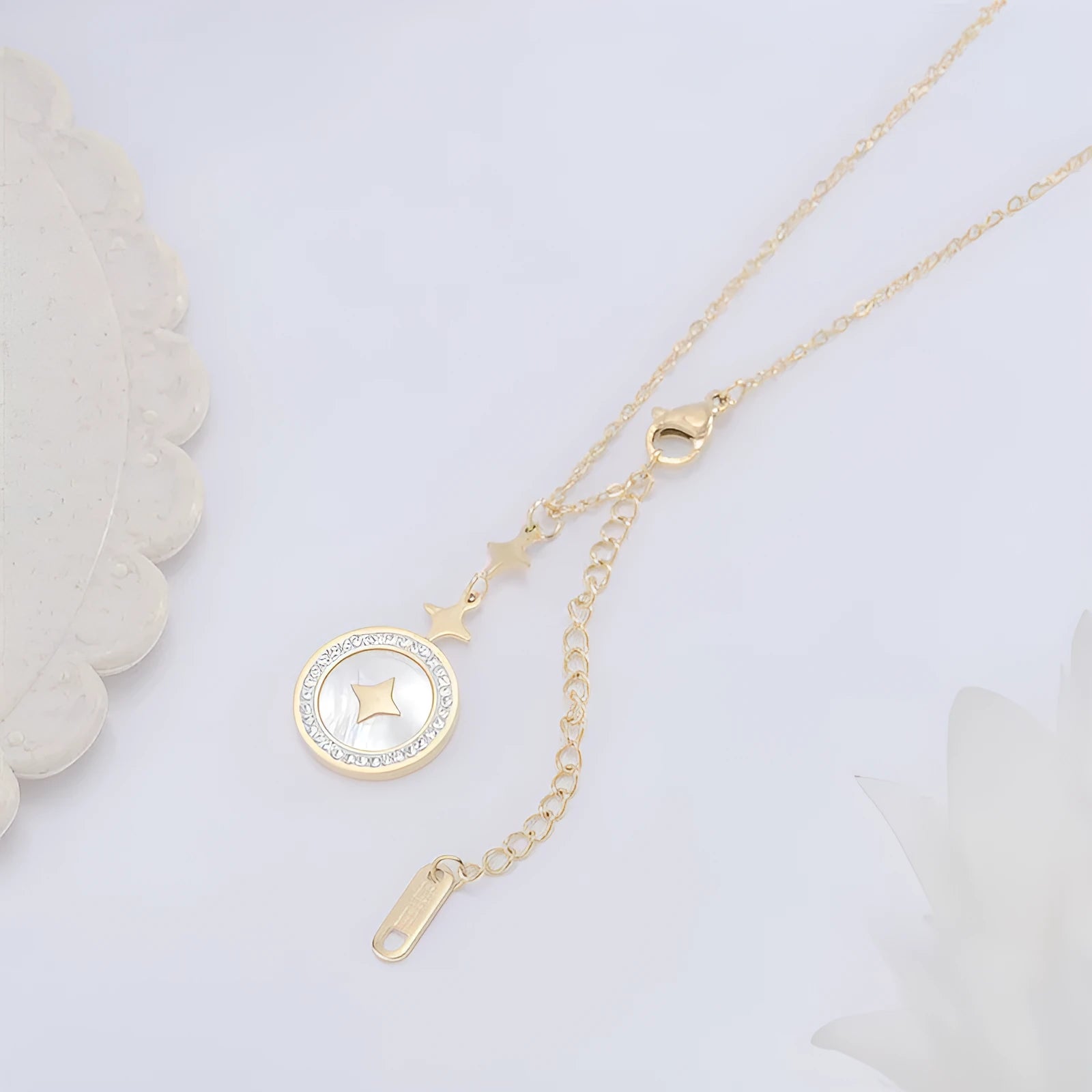 Gold hexagonal star pendant on a titanium steel chain necklace for women with an extender.