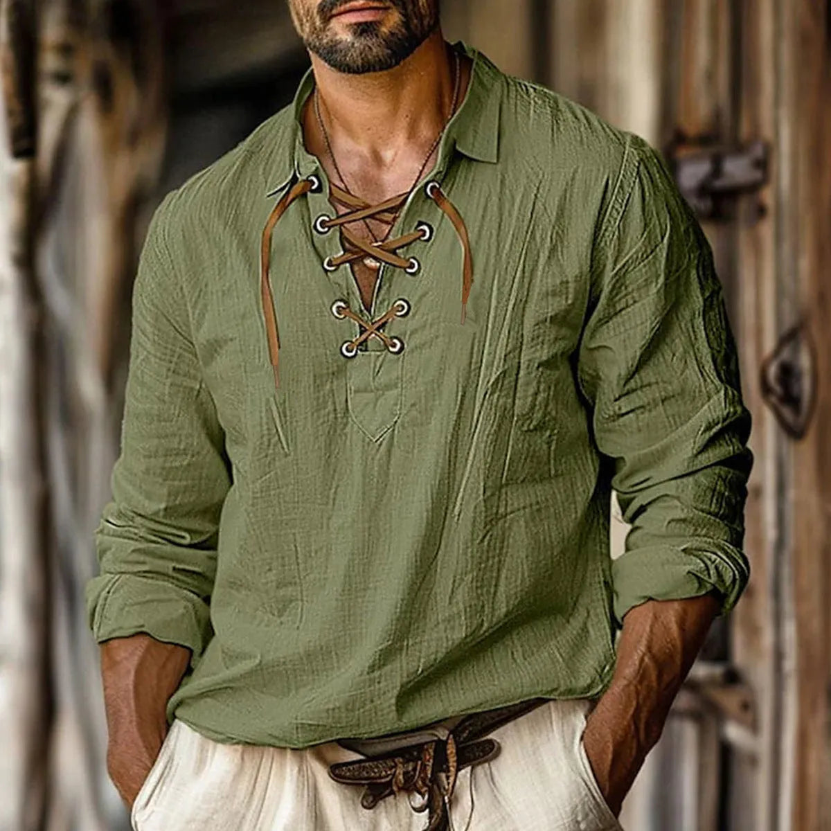 Men's loose-fit linen blend shirt in blue with lapels and lace detailing on the front.