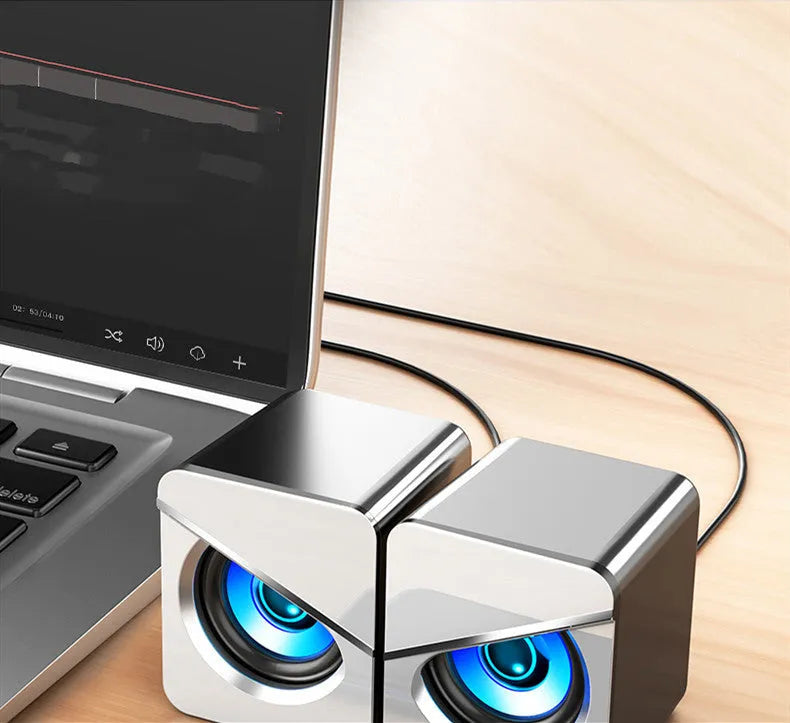 Black USB mini desktop speakers with independent volume knob and wired connection for computer audio