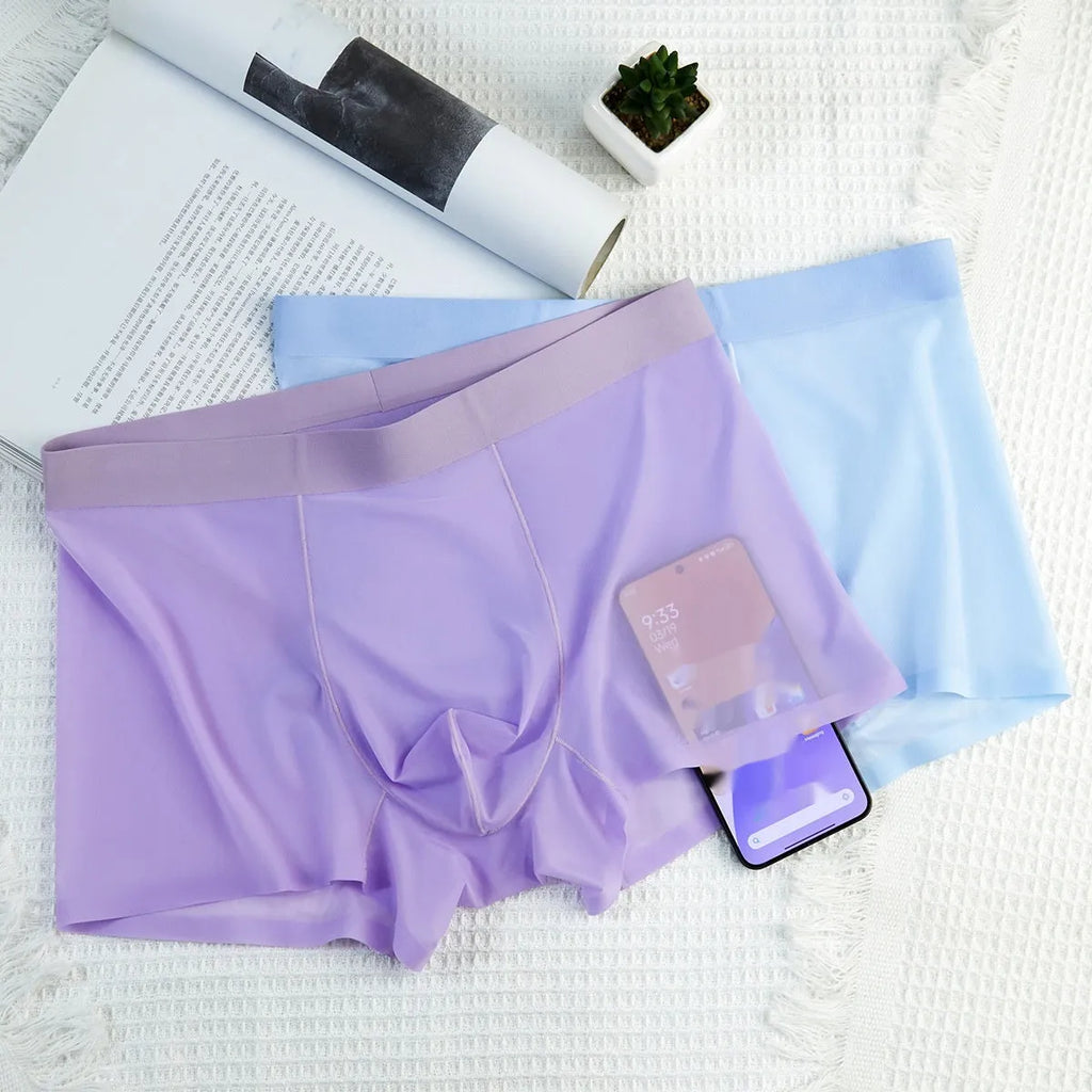 Men's ice silk boxer briefs in white, shown as breathable and seamless summer underwear.