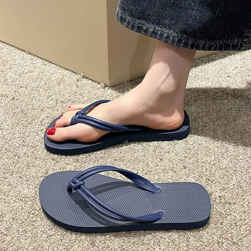 Men's casual PVC flip flops in beige with toe-covering style and injection moulded sole.