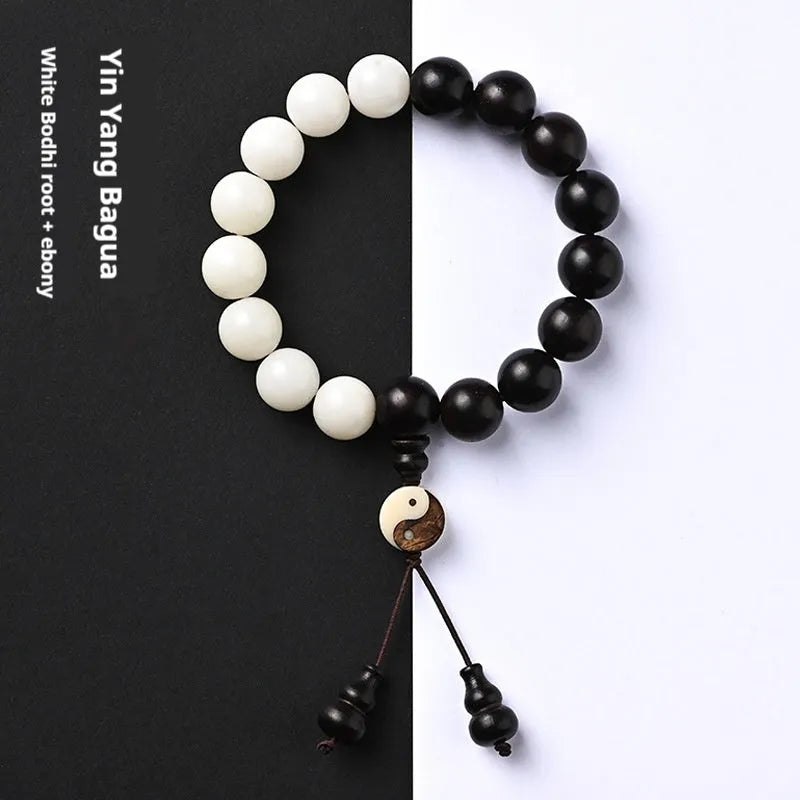 Close-up of a white retro eight-diagram-shaped Bodhi bead bracelet with 11mm beads on a black background.