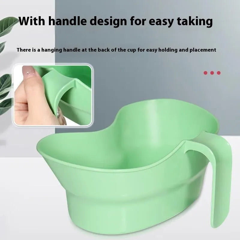 Green plastic nursing gargle cup with spout for bedridden patient drinking assistance