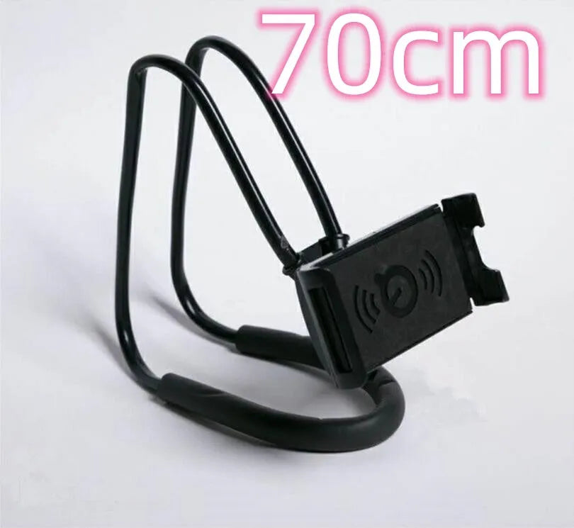 White plastic and foam 360-degree rotatable universal phone holder on a table.