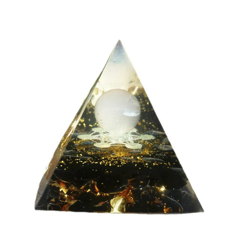 A clear 6cm tall epoxy resin pyramid hanging ornament for displaying crystals.